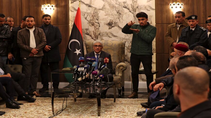 Libyan interim Prime Minister Fathi Bashagha delivers a speech at Mitiga International Airport in Tripoli on Feb. 10, 2022.