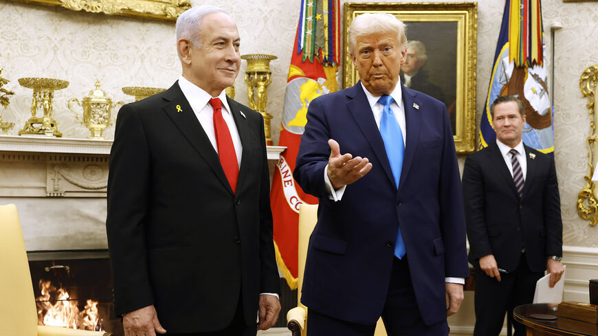 US President Donald Trump, accompanied by Israeli Prime Minister Benjamin Netanyahu (L), speaks during a meeting in the Oval Office of the White House, Washington, Feb. 4, 2025.