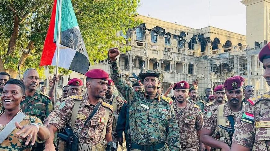 Sudan’s army commander in chief, Abdel Fattah al-Burhan, arrives with his supporters to the presidential palace in Khartoum on March 26, 2025.