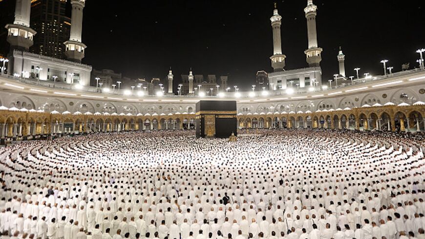 Muslims perform the morning prayer around the Kaaba at the Grand Mosque in Saudi Arabia's holy city of Mecca, early on March 30, 2025. 