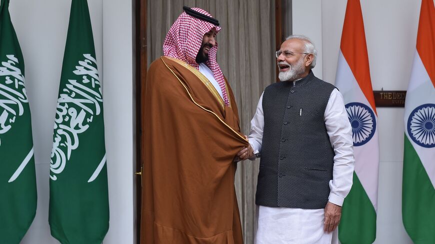 Indian Prime Minister Narendra Modi (R) shakes hands with Saudi Crown Prince Mohammed bin Salman prior to a meeting at Hyderabad House in New Delhi on Feb. 20, 2019.