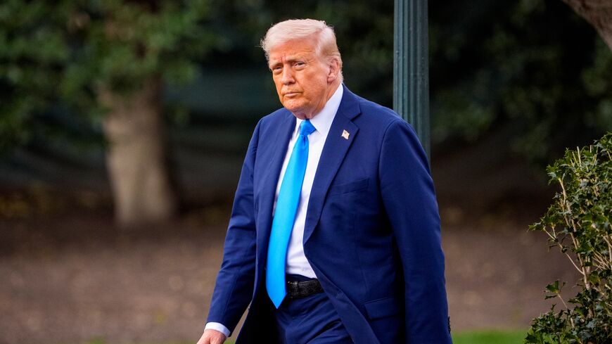 US President Donald Trump walks toward Marine One on the South Lawn of the White House, on March 28, 2025, in Washington.