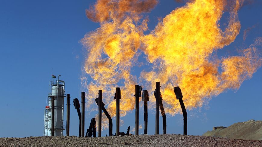 Excess flammable gasses burning from gas flares at the Havana oil field, west of the multi-ethnic northern Iraqi city of Kirku, Oct. 17, 2017.