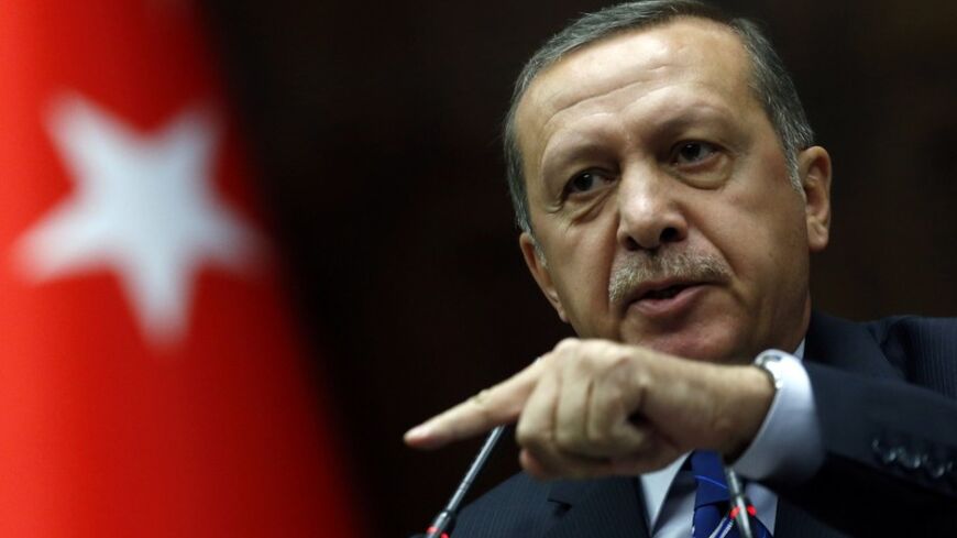 Turkey's Prime Minister Tayyip Erdogan addresses members of parliament from his ruling AK Party (AKP) during a meeting at the Turkish parliament in Ankara April 29, 2014. REUTERS/Umit Bektas (TURKEY - Tags: POLITICS) - RTR3N1XI