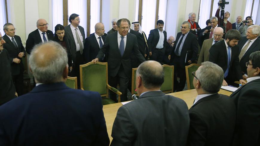 Russia's Foreign Minister Sergei Lavrov (C) attends a meeting with members of the Syrian opposition and the Damascus government ahead of talks that attempt to revive peace plan efforts in Syria, in Moscow, January 28, 2015. Russian Foreign Minister Sergei Lavrov urged members of the Syrian opposition and representatives from Damascus at peace talks in Moscow on Wednesday to join forces to combat the threat of "terrorism". Expectations of a breakthrough in Moscow are low, but Russia hopes the talks will giv