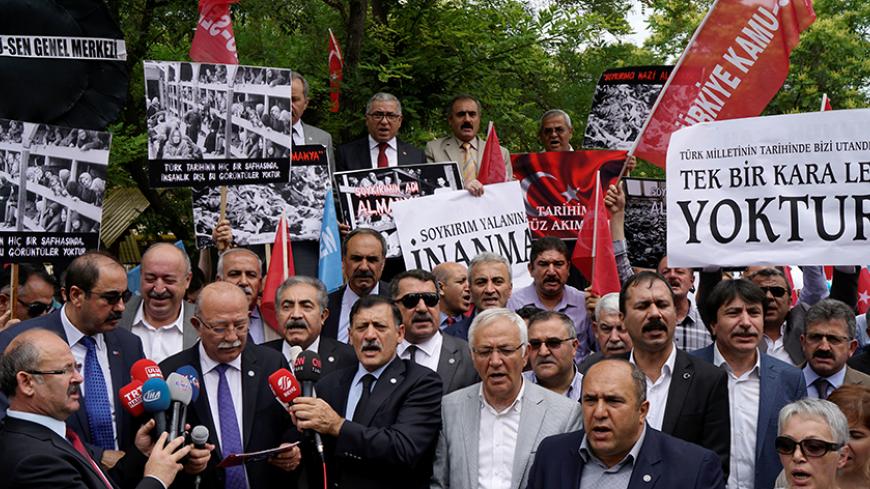 Turkish demonstrators stage a protest against approval of a resolution by Germany's parliament that declares the 1915 massacre of Armenians by Ottoman forces a "genocide" in front of the German Embassy in Ankara, Turkey, June 3, 2016. REUTERS/Umit Bektas - RTX2FHV5