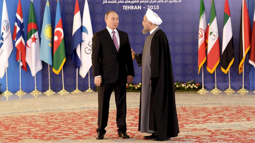 Iran's President Hassan Rouhani (R) welcomes Russia's President Vladimir Putin during the Gas Exporting Countries Forum (GECF) in Tehran, Iran, November 23, 2015. REUTERS/Raheb Homavandi/TIMA ATTENTION EDITORS - THIS IMAGE WAS PROVIDED BY A THIRD PARTY. FOR EDITORIAL USE ONLY. - RTX1VGAC