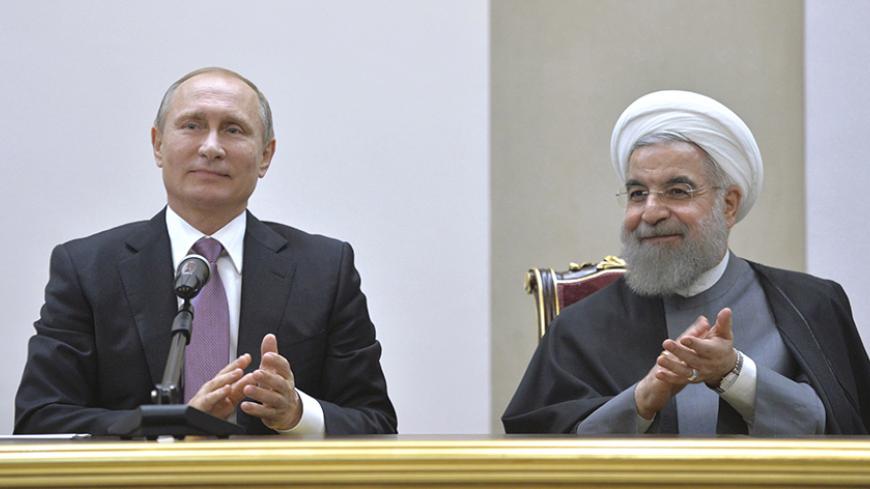 Russian President Vladimir Putin (L) and his Iranian counterpart Hassan Rouhani attend a news conference after the talks in Tehran, Iran, November 23, 2015. To match Insight RUSSIA-IRAN/ Alexei Druzhinin/Sputnik/Kremlin/File Photo via Reuters ATTENTION EDITORS - THIS IMAGE WAS PROVIDED BY A THIRD PARTY. EDITORIAL USE ONLY. - RTX2BOG5