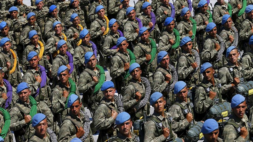 Turkish soldiers march during a parade marking the 93rd anniversary of Victory Day in Ankara, Turkey, August 30, 2015. REUTERS/Umit Bektas - RTX1Q9QG