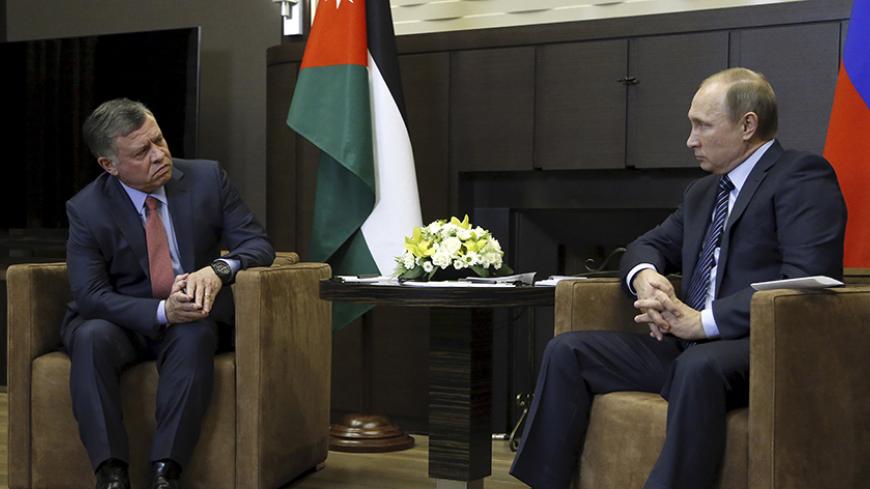 Russian President Vladimir Putin (R) and Jordan's King Abdullah attend a meeting at the Bocharov Ruchei state residence in Sochi, Russia November 24, 2015. Speaking before a meeting with Jordan's King Abdullah, Putin called Turkey's downing of a Russian fighter jet "a stab in the back" carried out by the accomplices of terrorists, saying the incident would have serious consequences for Moscow's relations with Ankara. REUTERS/Maxim Shipenkov/Pool      TPX IMAGES OF THE DAY           TPX IMAGES OF THE DAY    