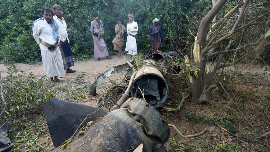 Tribesmen inspect fragments of a Houthi ballistic missile at a farm after it was intercepted by the Saudi-led coalition's air defence forces in Marib, Yemen February 23, 2018. Picture taken with a fisheye lens. REUTERS/Ali Owidha - RC1974FC90C0