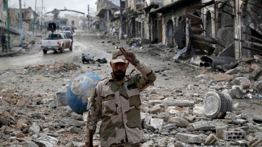 A Syrian army soldier gestures in Maarat al-Numan, Syria, January 30, 2020. REUTERS/Yamam Al Shaar - RC2GQE9GEP2D