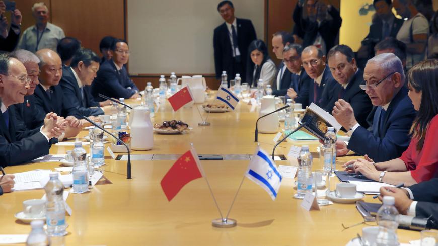 Israeli Prime Minister Benjamin Netanyahu (2 R) talks during a meeting with Chinese Vice President Wang Qishan (L) in Jerusalem, on October 24, 2018. - Chinese Vice President Wang Qishan on Monday became the most senior Beijing official to visit Israel in 18 years, as the two countries look to bolster their growing business ties. (Photo by Ariel Schalit / POOL / AFP) (Photo credit should read ARIEL SCHALIT/AFP via Getty Images)