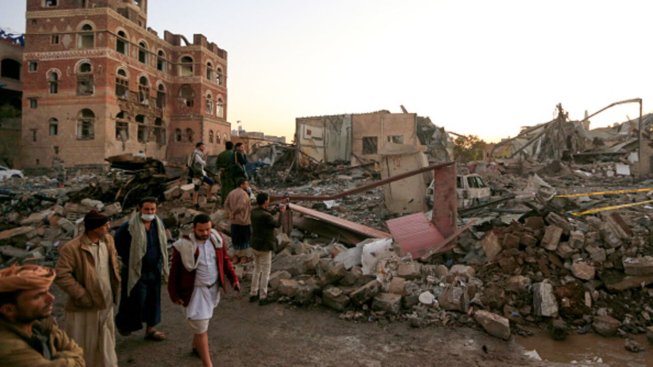 Men check the damages in an area struck by a US airstrike in Huthi-controlled Sanaa on March 20, 2025. Israel said it intercepted a missile launched from Yemen on March 20, as the Iran-backed Huthi rebels claimed to have targeted Ben Gurion international airport. The United States, Israel's main backer, has pledged to hit Yemen with lethal and overwhelming force until the Huthis stop their harassment campaign. (Photo by MOHAMMED HUWAIS / AFP) (Photo by MOHAMMED HUWAIS/AFP via Getty Images)