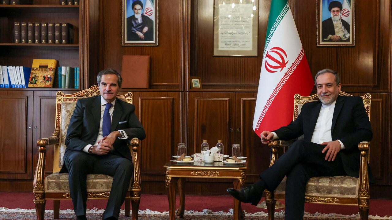 Iran's Foreign Minister Abbas Araghchi (R) and International Atomic Energy Agency (IAEA) Director General Rafael Mariano Grossi pose for a photo before their meeting in Tehran on November 14, 2024. (Photo by Atta KENARE / AFP) (Photo by ATTA KENARE/AFP via Getty Images)