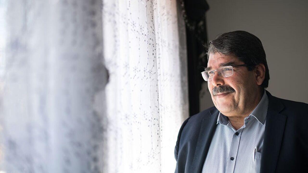 Par7730006 Salih Muslim, co-president of the Syrian Kurdish Democratic Union Party (PYD), poses during an interview in Marseille, southern France, on December 1, 2013. PYD, the biggest Kurdish armed group, wants to establish an autonomous Kurdish state within a federal Syria and a commission is already writing the constitution of this potential state, Muslim told AFP. Syrian Kurds in the war-torn country's northeast announced last month the formation of a transitional autonomous administration after making key territo