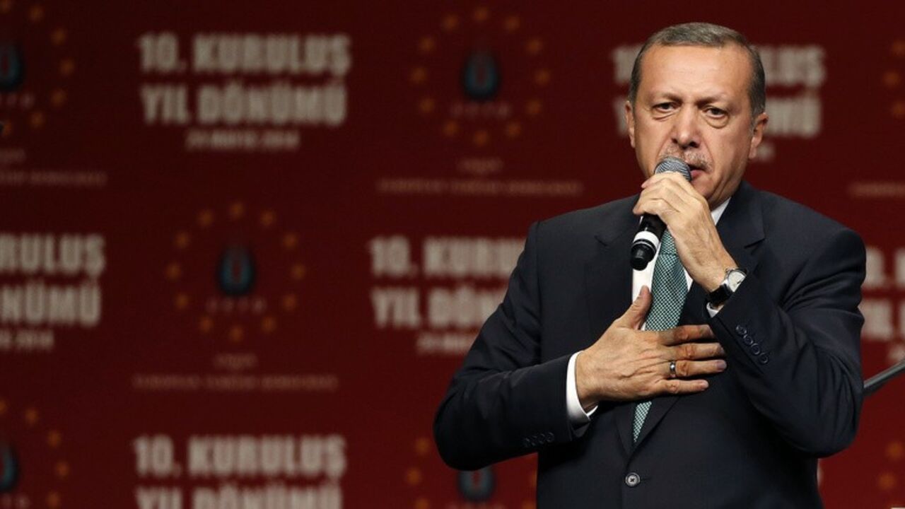 Turkish Prime Minister Erdogan speaks to supporters during his visit in Cologne Turkish Prime Minister Tayyip Erdogan speaks to supporters during his visit in Cologne May 24, 2014. REUTERS/Wolfgang Rattay (GERMANY - Tags: POLITICS CIVIL UNREST) - RTR3QNX8