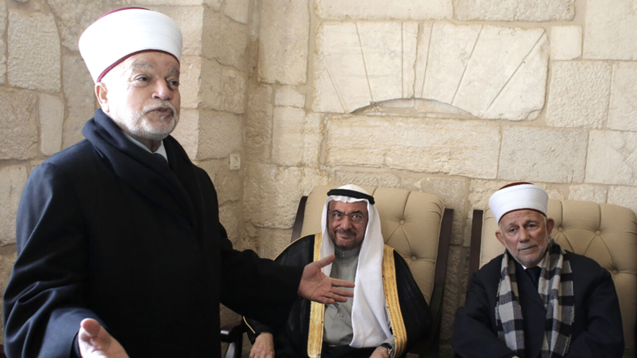 Nic6403264 Iyad bin Amin Madani, secretary general of the Organization of Islamic Cooperation (C) meets with the Mufti of Jerusalem Mohammed Hussein (L) during his visit to the Al-Aqsa mosque compound, Islam's third holiest site, in the old city of Jerusalem on January 5, 2015. AFP PHOTO/ AHMAD GHARABLI (Photo credit should read AHMAD GHARABLI/AFP/Getty Images)