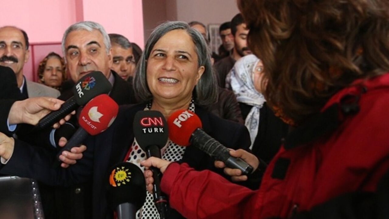 TURKEY-VOTE-BDP-KISANAK Gulten Kisanak, the Peace and Democracy party candidate campaigning to be Mayor of Diyarbakir, speaks with journalists after casting her ballot in Diyarbakir on March 30, 2014, during municipal elections in Turkey ahead of a presidential vote in six months and parliamentary polls next year. Turkey's Premier Recep Tayyip Erdogan, embattled by protests and corruption scandals, faced a crucial popularity test today when over 50 million eligible voters cast their ballots in local elections. More than 50 million
