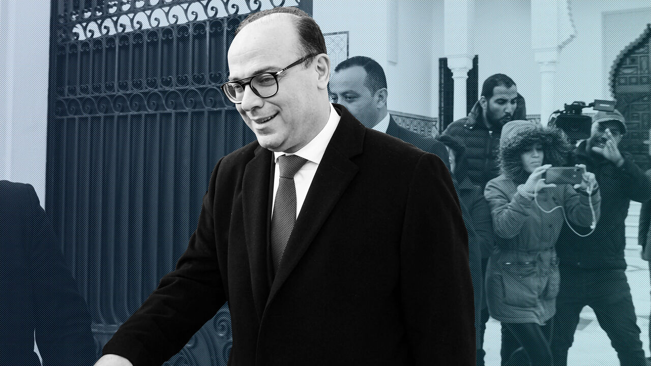 1195130951 Tunisia's prime minister-designate Elyes Fakhfakh (front), tasked with forming a government, leaves his office in the capital Tunis on January 21, 2019. (Photo by FETHI BELAID / AFP) (Photo by FETHI BELAID/AFP via Getty Images)