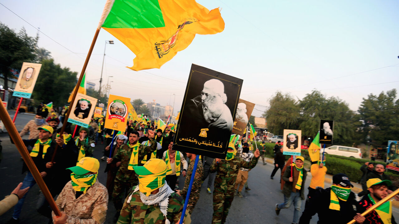 IRAQ-SECURITY/FUNERAL Kataib Hezbollah Iraqi militia gather ahead of the funeral of the Iraqi militia commander Abu Mahdi al-Muhandis, who was killed in an air strike at Baghdad airport, in Baghdad, Iraq, January 4, 2020. REUTERS/Thaier al-Sudani - RC2V8E98XQZT