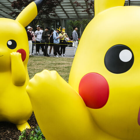 TOPSHOT - People queue to visit statues of Pokemon characters displayed outside the Lotte World Tower in Seoul on April 26, 2024. (Photo by ANTHONY WALLACE / AFP) (Photo by ANTHONY WALLACE/AFP via Getty Images)